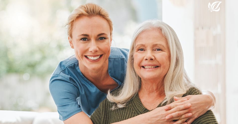 memory care blog header, senior and care giver embrace